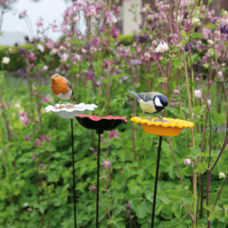 vogeltjes op bloemenstandaard